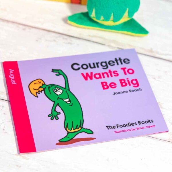 A flatlay image of the book Courgette Wants To Be Big – The Foodies veggie patch story for August, on a worktop background.
