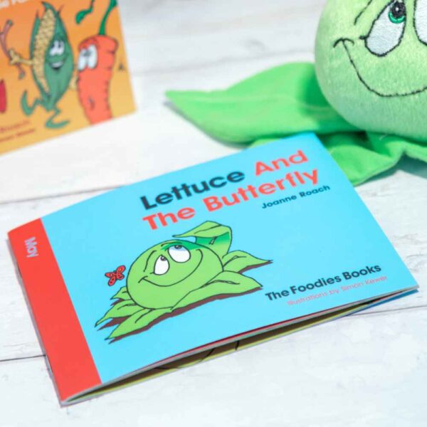 A flatlay image of the book Lettuce And The Butterfly – The Foodies veggie patch story for May, on a worktop background.